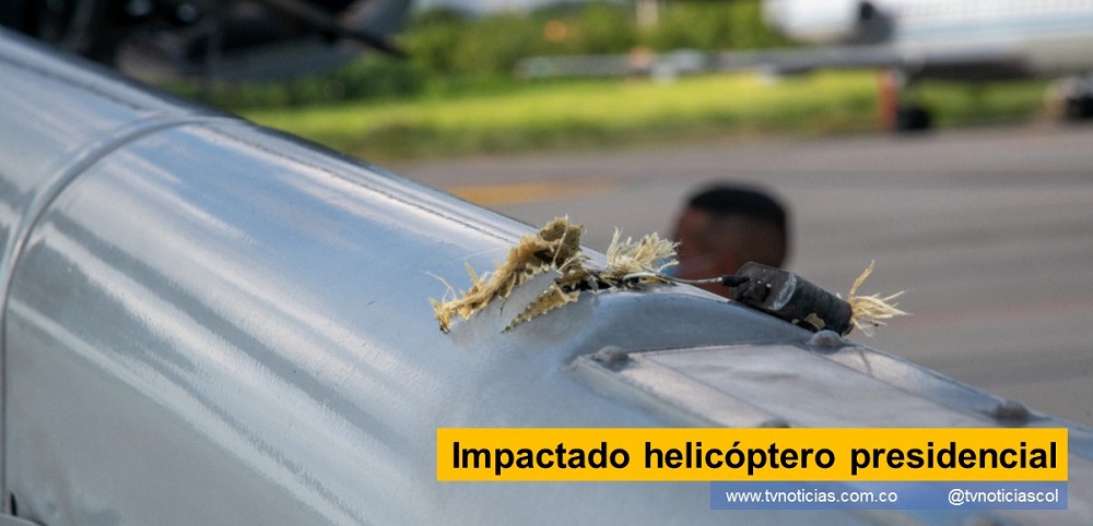 El helicóptero donde se desplazaba el Presidente de la República de Colombia, Iván Duque Márquez, fue impactado con varios proyectiles en tierra santanderianas, el viernes 26 de junio. La poderosa aeronave, vigilada por un especial equipo de seguridad de la Fuerza Aérea, no fue derribado y ninguno de los ocupantes resultó herido, de acuerdo a los informes provenientes de La Casa de Nariño Impactado helicóptero presidencial - www.tvnoticias.com.co tvnoticiascol TVNOTICIAS.COM